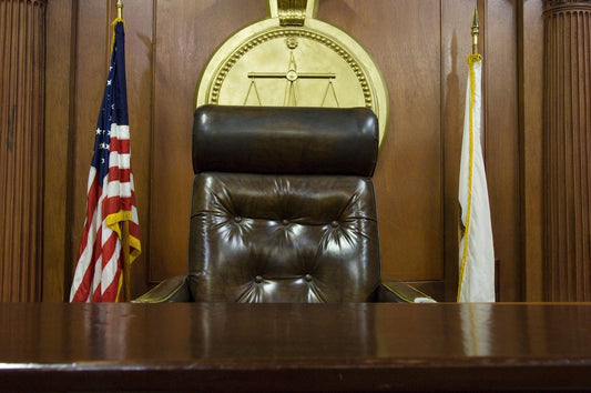 Leather executive chair in professional workplace setting showing design and symbolism